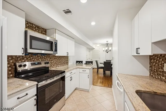 a kitchen with a stove and a sink