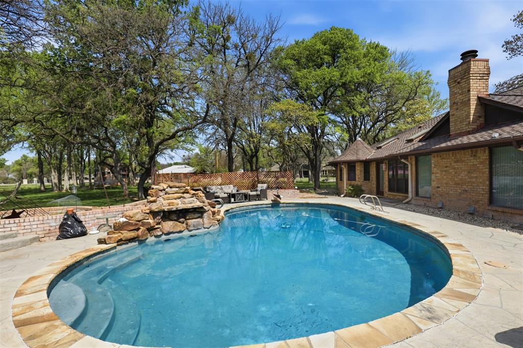 3000 Yucca Road Willow Park, TX 76087 - Photo 20 of 38 a view of a swimming pool with a patio