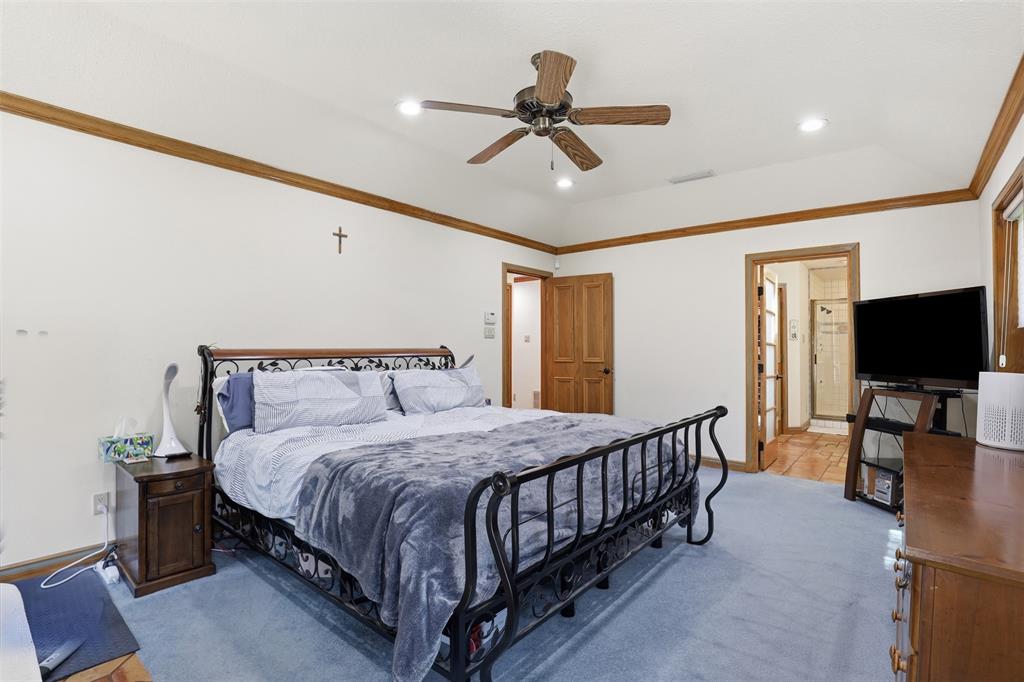 3000 Yucca Road Willow Park, TX 76087 - Photo 25 of 38 a bedroom with a bed and a flat screen tv