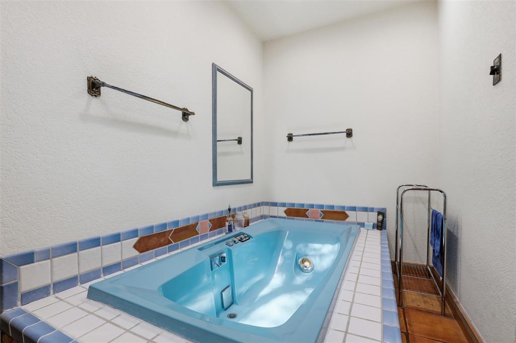 3000 Yucca Road Willow Park, TX 76087 - Photo 27 of 38 a bathroom with a tub and a shower