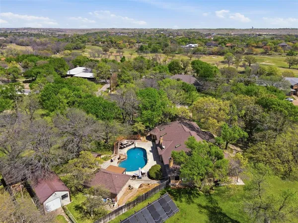 a view of a park with large trees