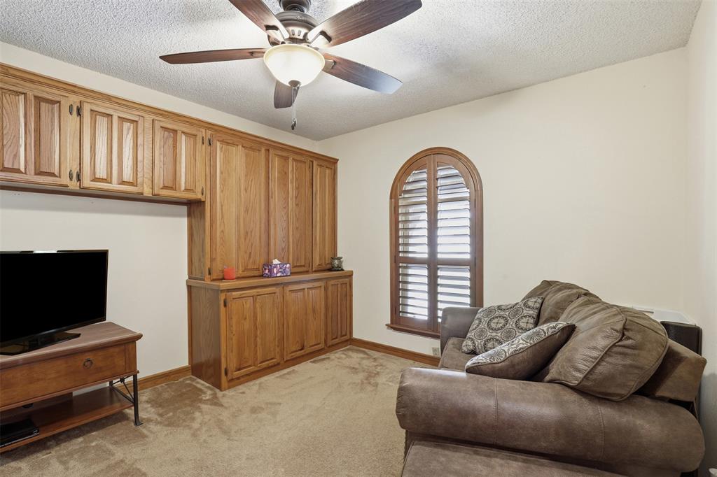 3000 Yucca Road Willow Park, TX 76087 - Photo 32 of 38 a living room with furniture and a fireplace