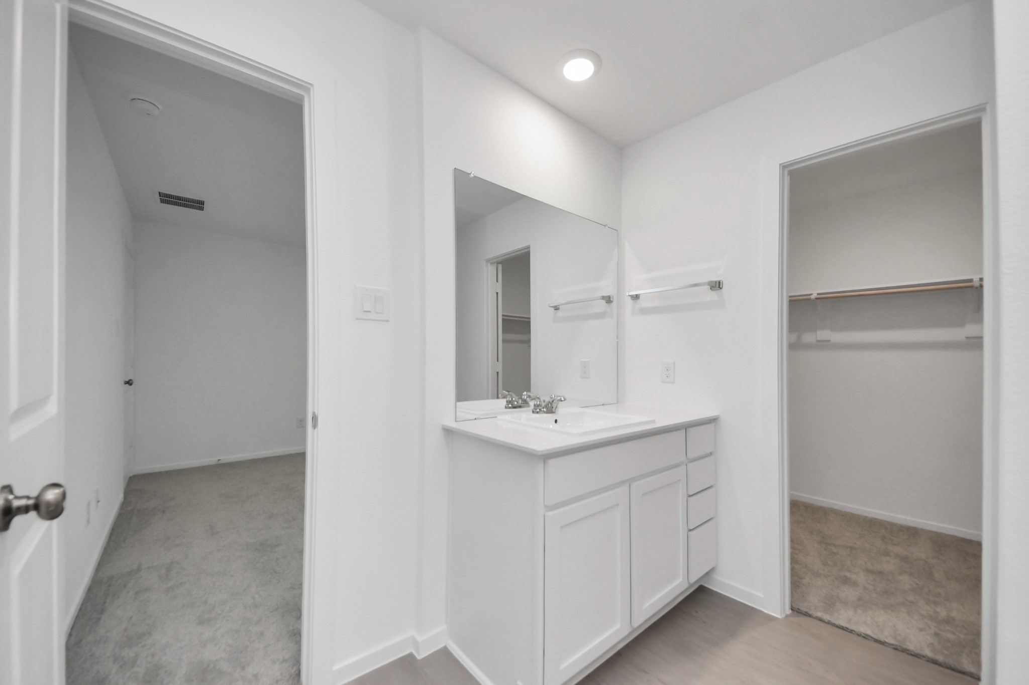 7730 Lavender Jade Drive Rosharon, TX 77583 - Photo 28 of 45 a bathroom with a sink a light fixture a vanity and a mirror
