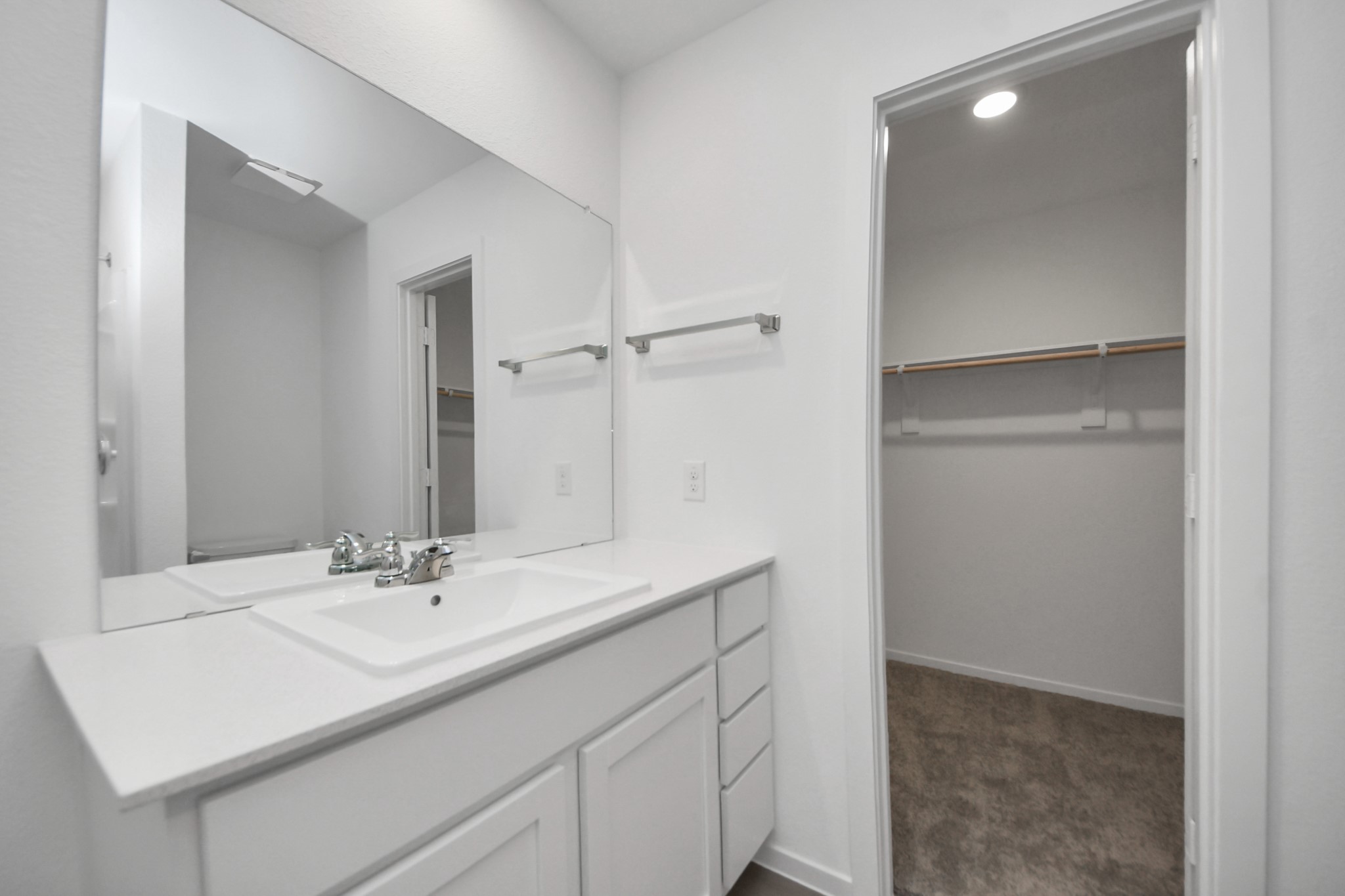 7730 Lavender Jade Drive Rosharon, TX 77583 - Photo 32 of 45 a bathroom with a sink and a mirror