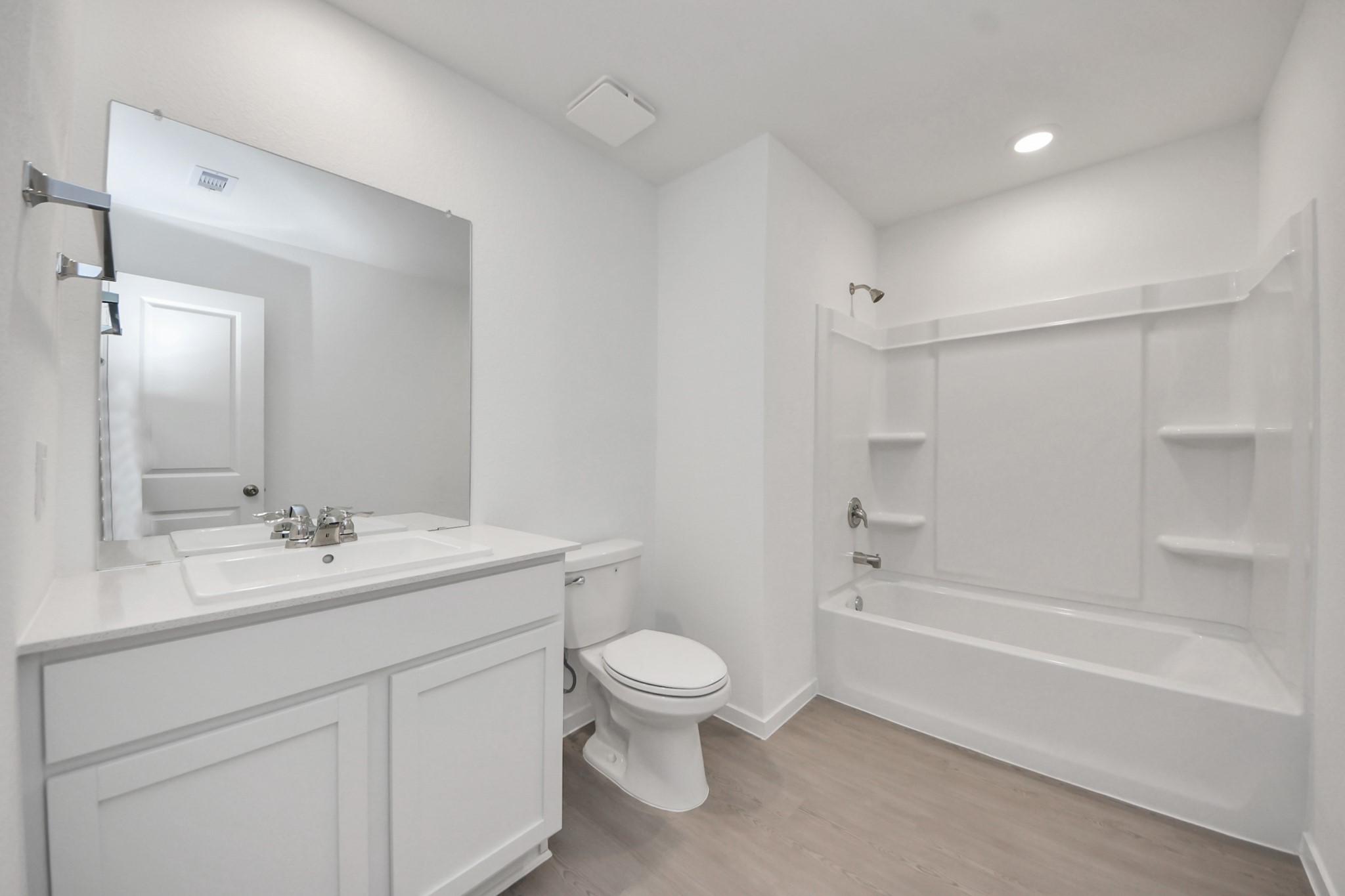 7730 Lavender Jade Drive Rosharon, TX 77583 - Photo 38 of 45 a bathroom with a sink a toilet and a large mirror
