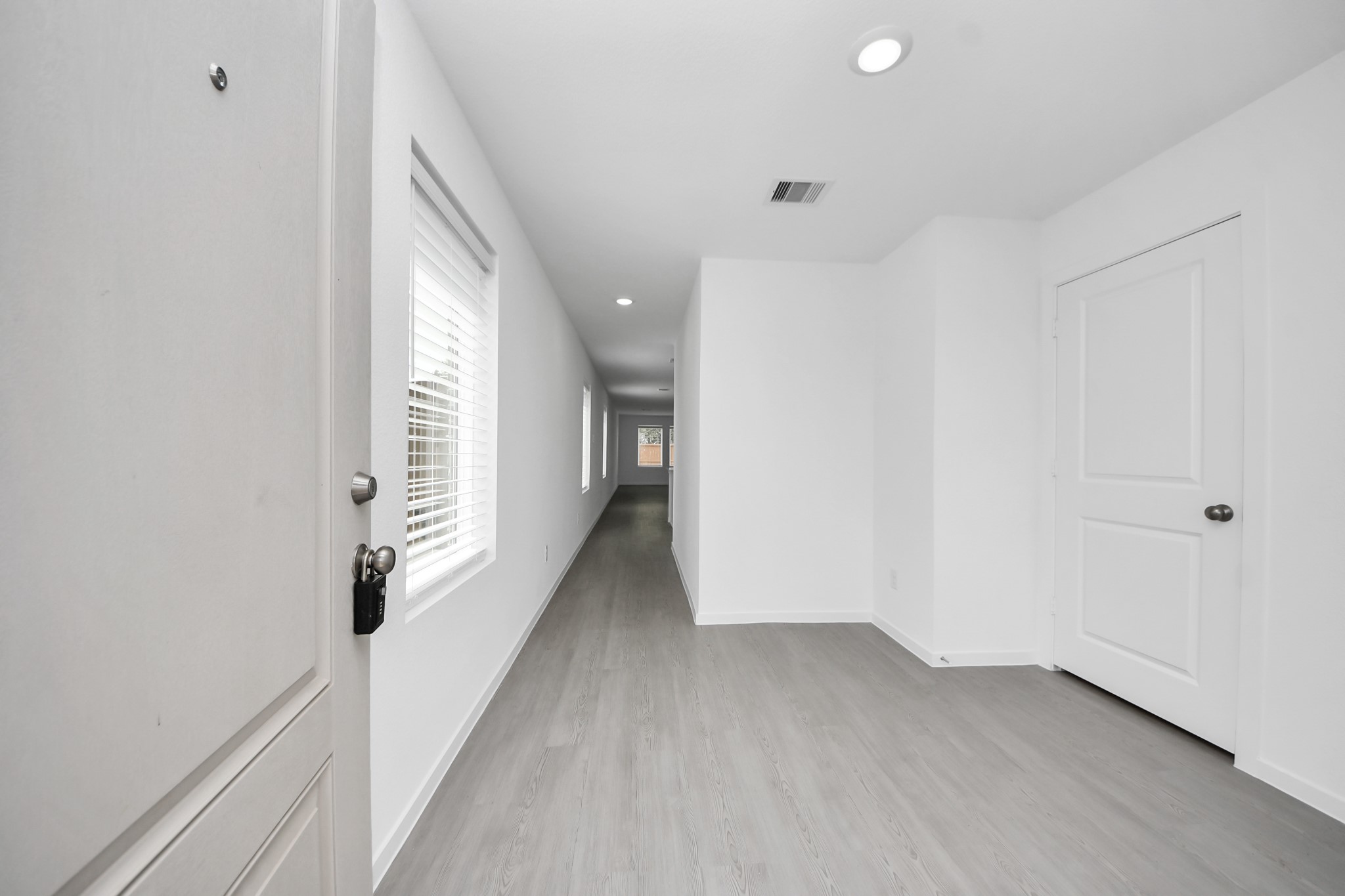 7730 Lavender Jade Drive Rosharon, TX 77583 - Photo 5 of 45 a view of hallway with wooden floor