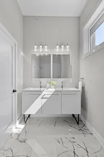 a bathroom with a sink and mirror