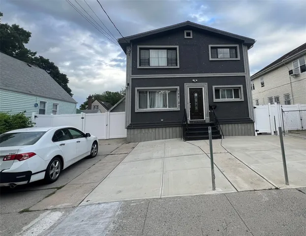 a car parked in front of a house