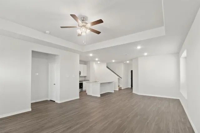 a view of an empty room and wooden floor