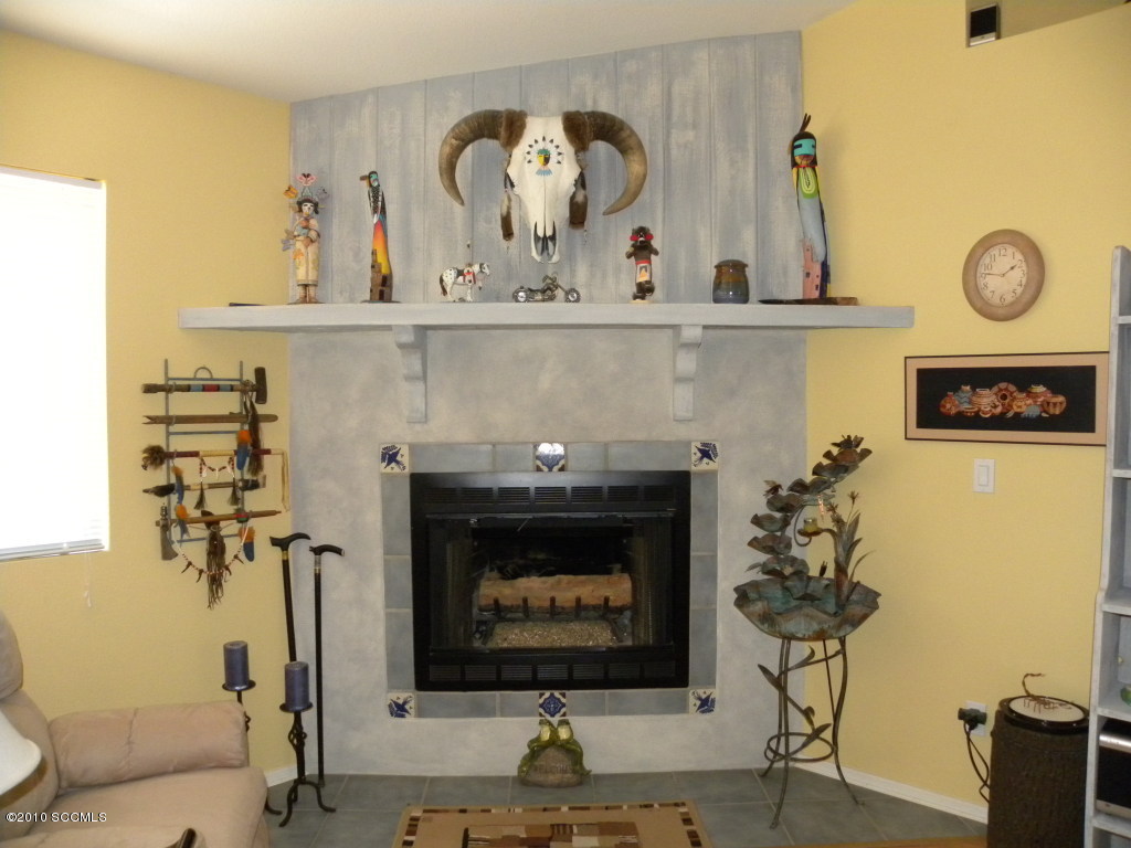 1505 Diablo Court Rio Rico, AZ 85648 - Photo 3 of 7 a living room with painting on wall and a potted plant
