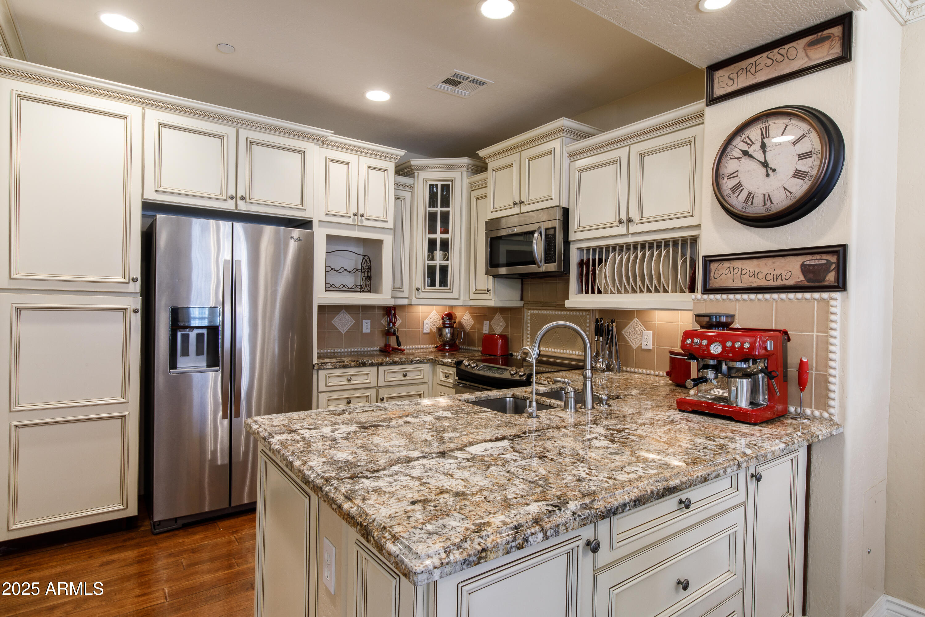 2450 East Roma Avenue, Unit 8 Phoenix, AZ 85016 - Photo 11 of 33 a kitchen with stainless steel appliances granite countertop a stove refrigerator and cabinets