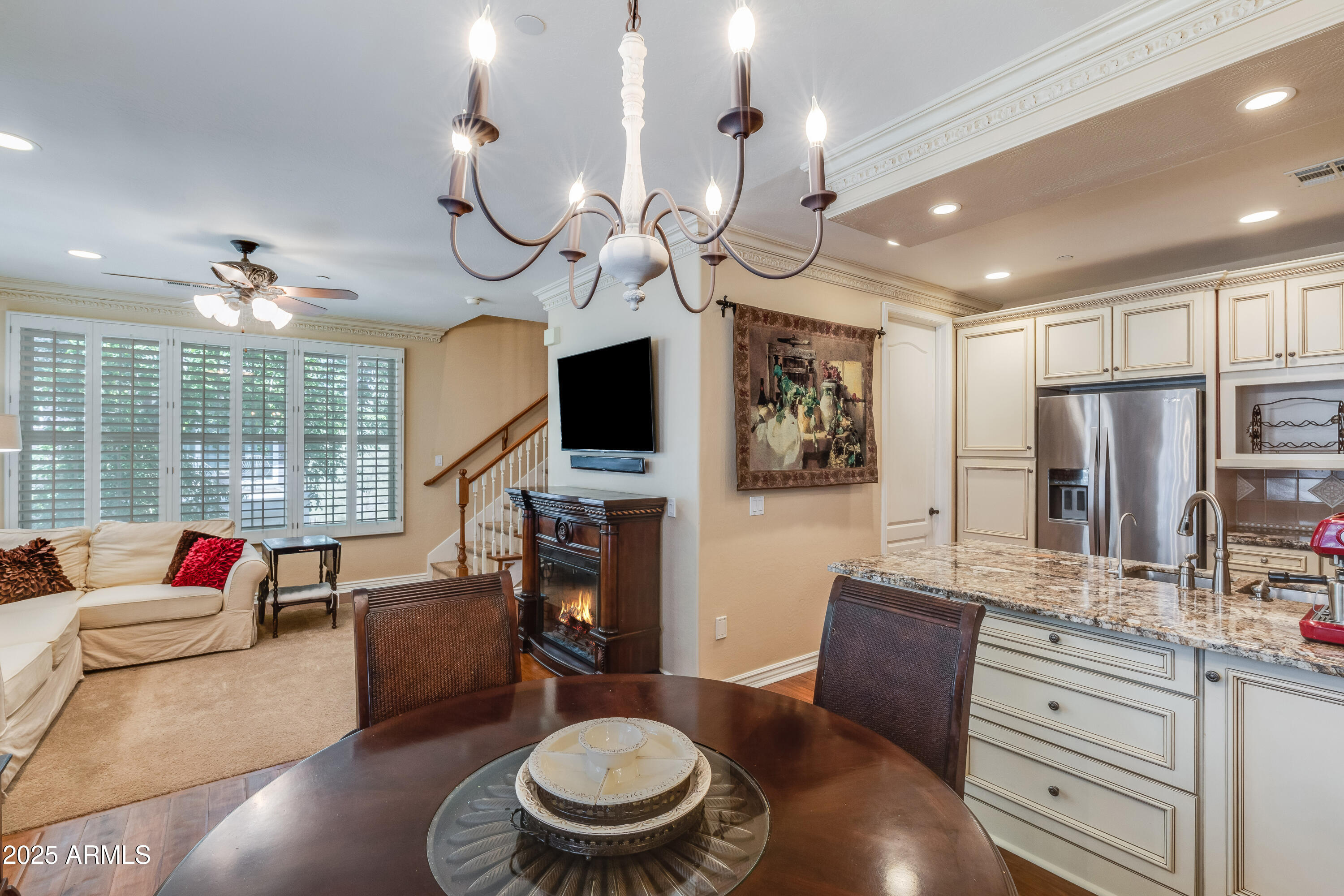 2450 East Roma Avenue, Unit 8 Phoenix, AZ 85016 - Photo 17 of 33 a living room with furniture a flat screen tv and a large window