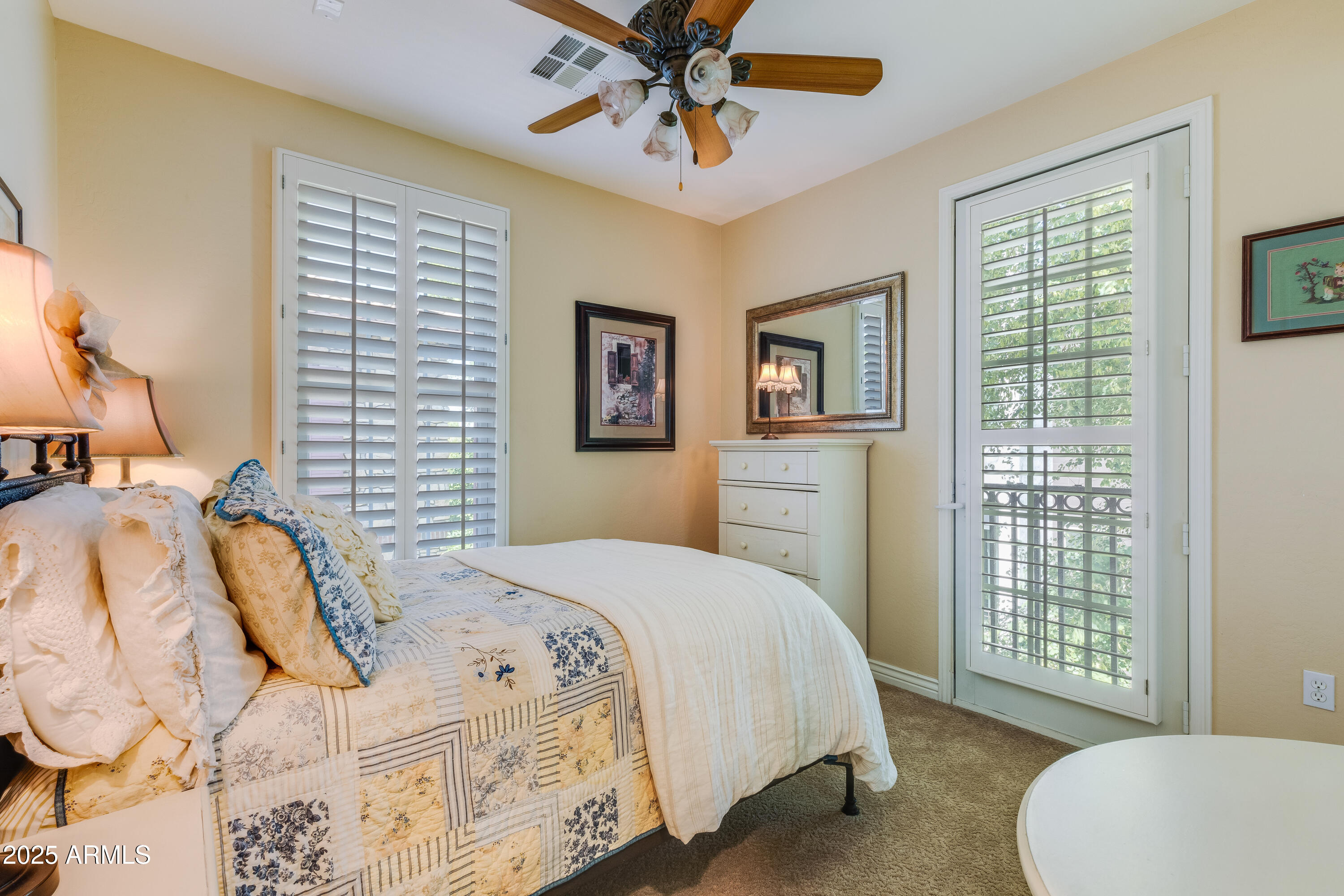 2450 East Roma Avenue, Unit 8 Phoenix, AZ 85016 - Photo 27 of 33 a bedroom with a bed and a chandelier