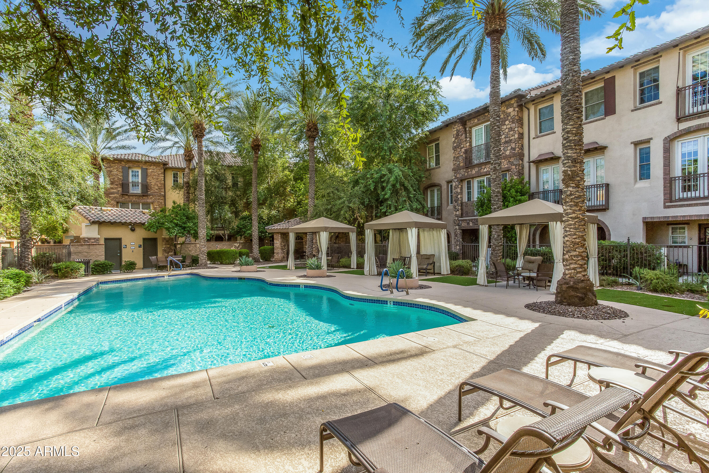 2450 East Roma Avenue, Unit 8 Phoenix, AZ 85016 - Photo 31 of 33 a front view of a house with a yard table and chairs