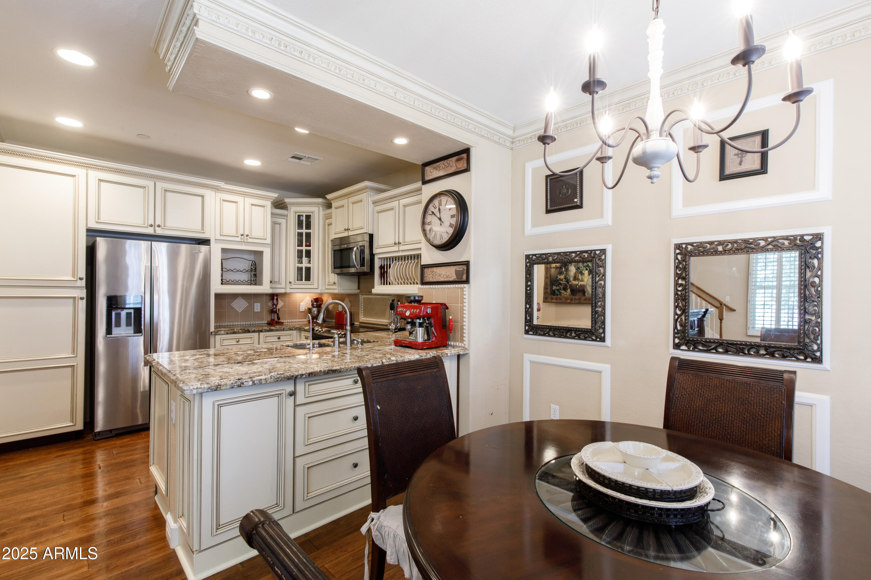 2450 East Roma Avenue, Unit 8 Phoenix, AZ 85016 - Photo 10 of 33 a kitchen with stainless steel appliances granite countertop a sink a stove a refrigerator cabinets and dining table