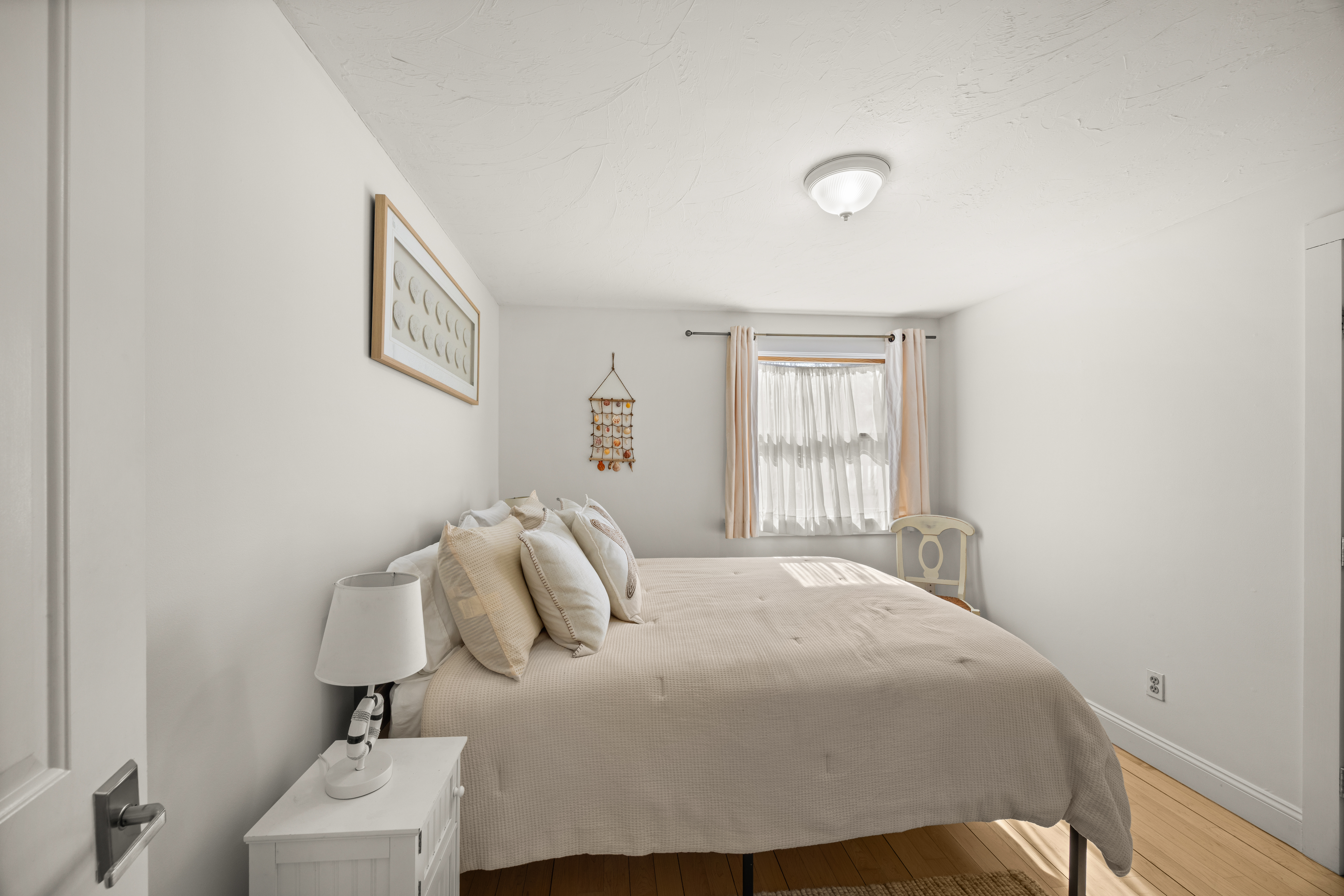 58 Rd To The Plaines Edgartown, MA 02539 - Photo 24 of 40 a bedroom with a bed and a window