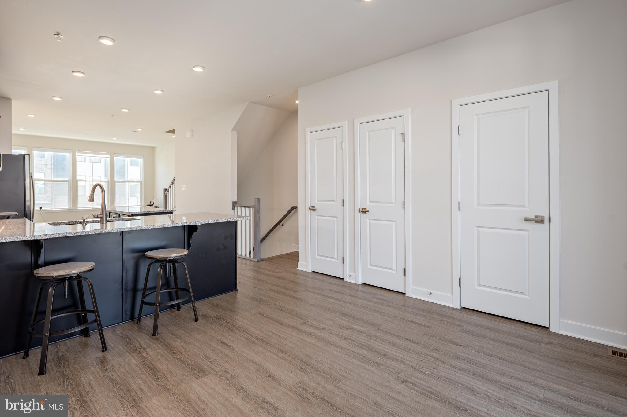1920 Four Roses Street Baltimore, MD 21222 - Photo 13 of 37 a open dining hall with wooden floor and cabinets