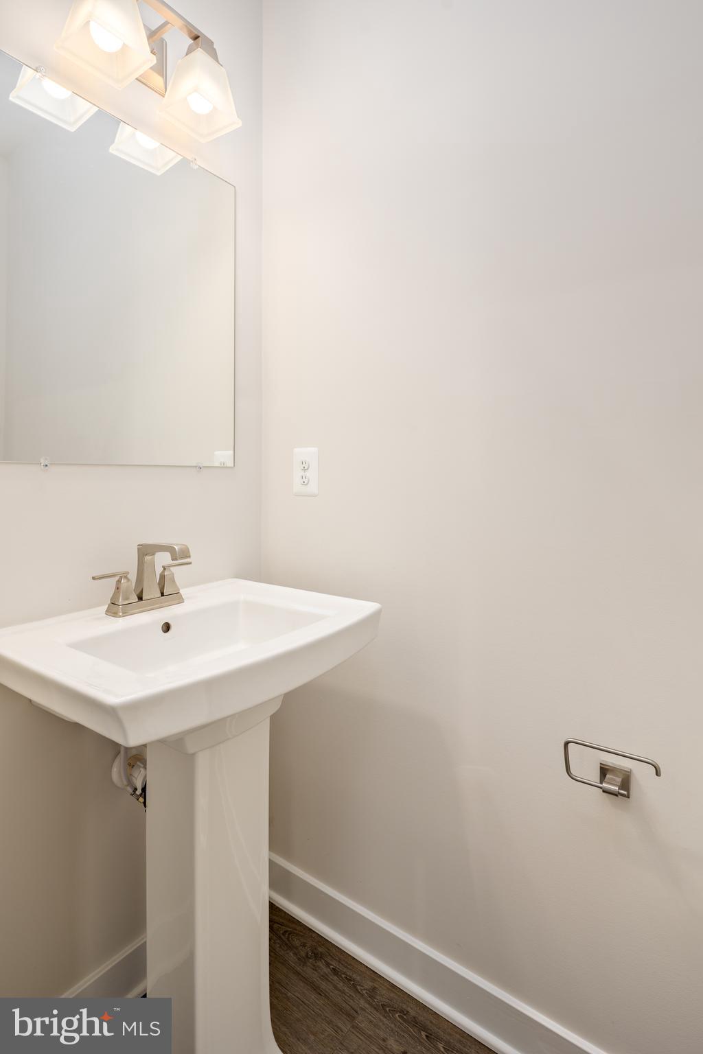 1920 Four Roses Street Baltimore, MD 21222 - Photo 14 of 37 a bathroom with a sink and a mirror
