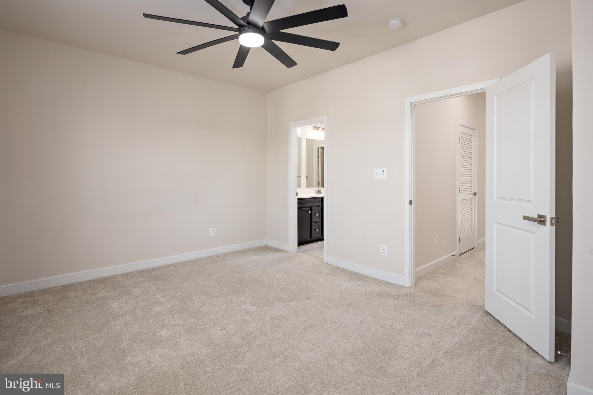 1920 Four Roses Street Baltimore, MD 21222 - Photo 16 of 37 an empty room with closet and a chandelier fan