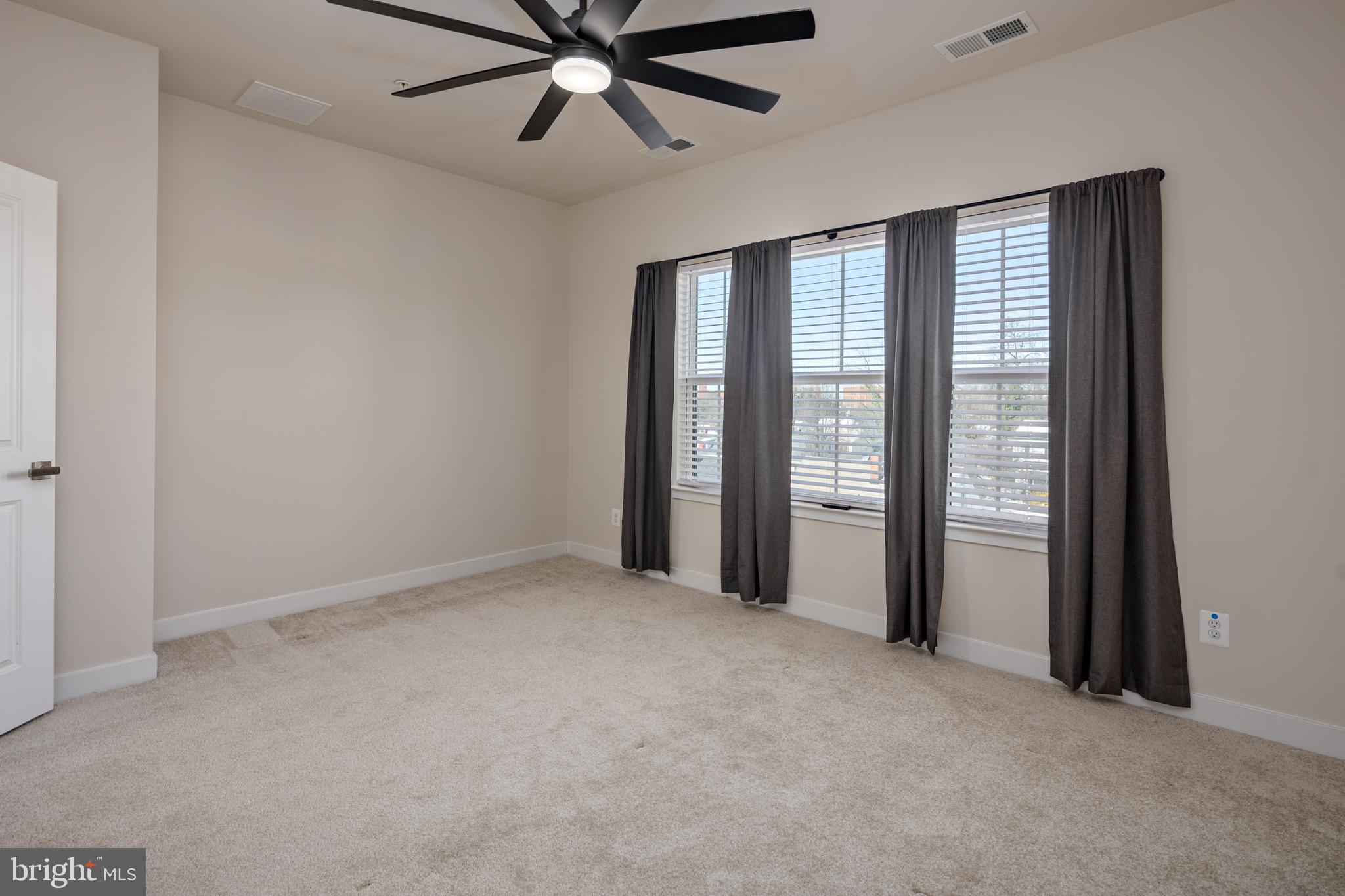 1920 Four Roses Street Baltimore, MD 21222 - Photo 17 of 37 a view of an empty room with a window