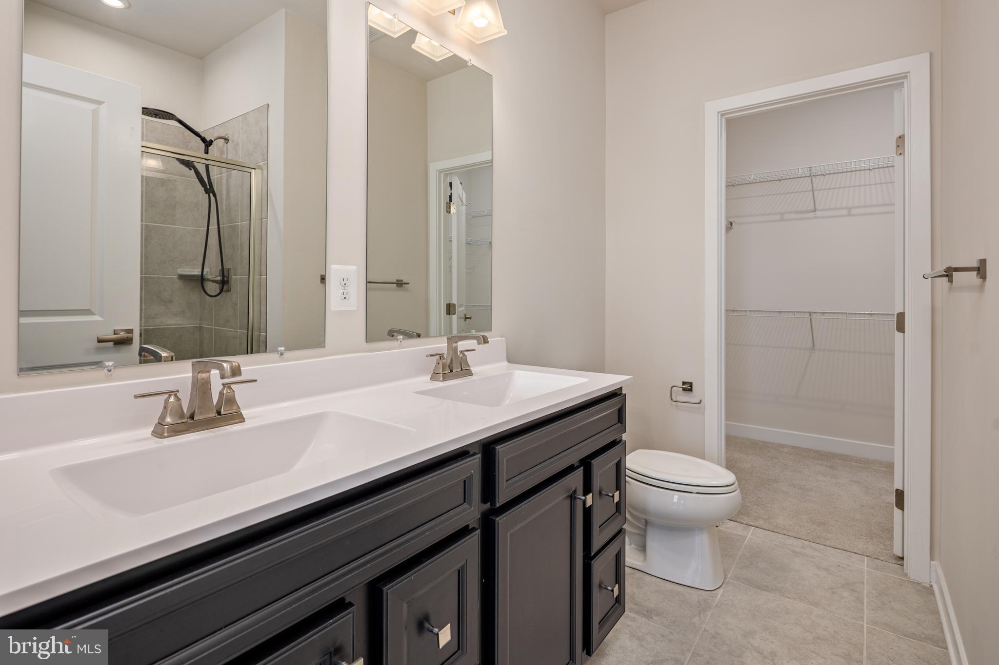 1920 Four Roses Street Baltimore, MD 21222 - Photo 18 of 37 a bathroom with a sink a toilet and shower