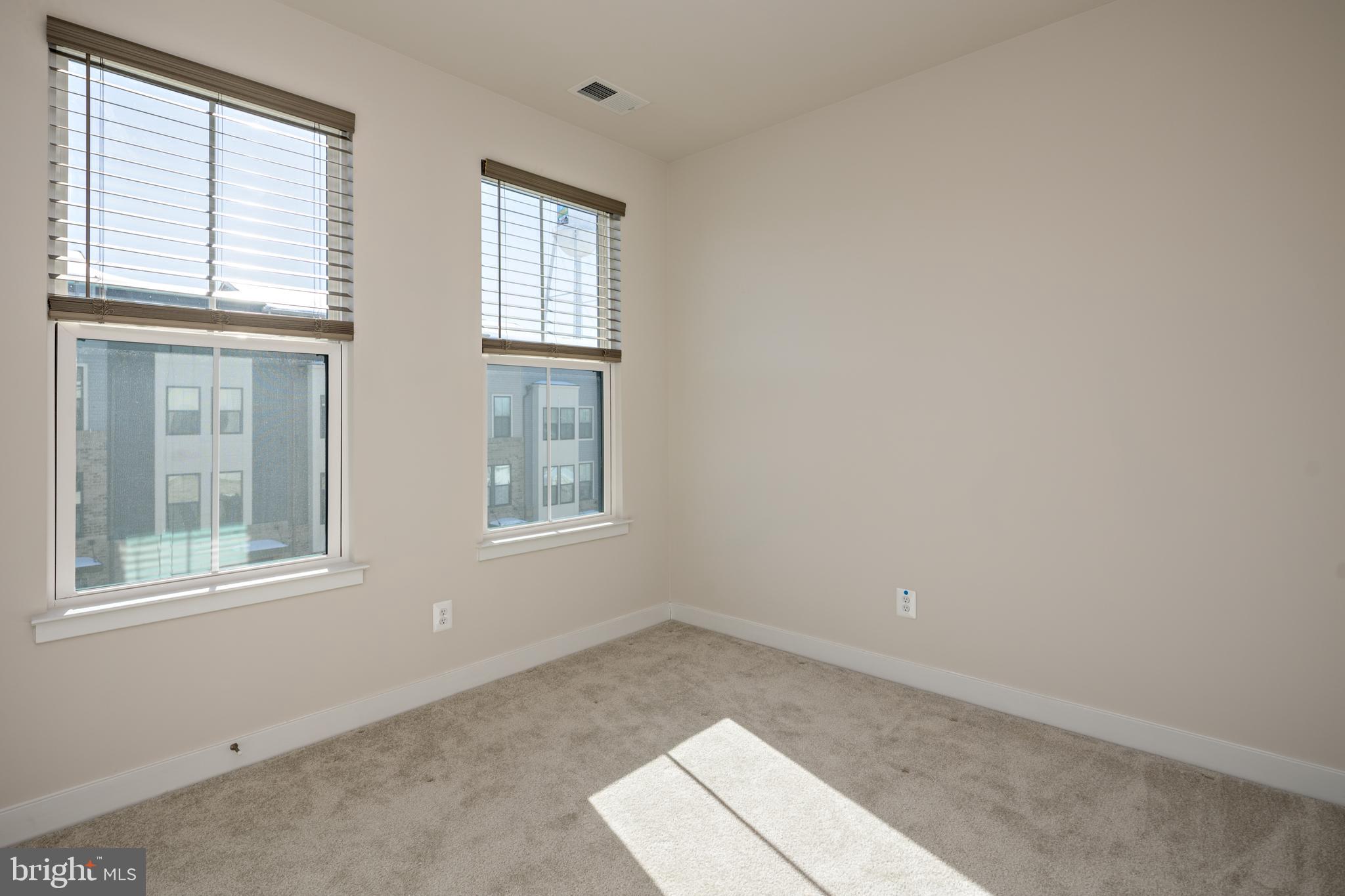 1920 Four Roses Street Baltimore, MD 21222 - Photo 25 of 37 an empty room with windows