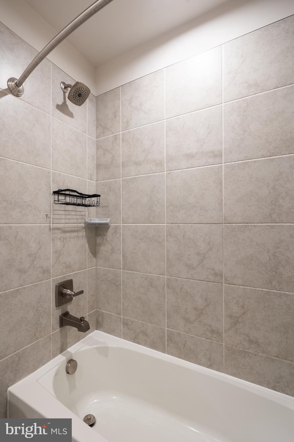 1920 Four Roses Street Baltimore, MD 21222 - Photo 33 of 37 a bathroom with a bathtub and a shower