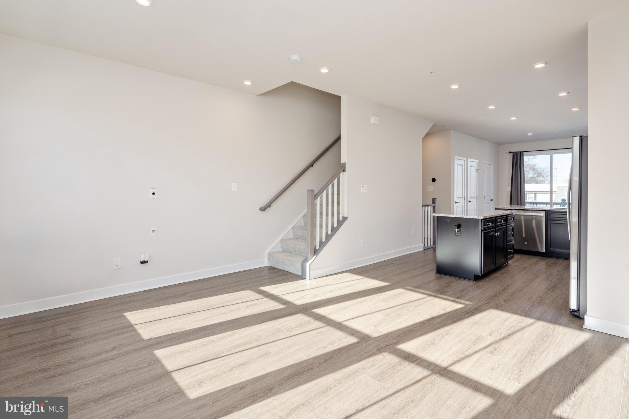 1920 Four Roses Street Baltimore, MD 21222 - Photo 4 of 37 a living room with stainless steel appliances furniture and kitchen view