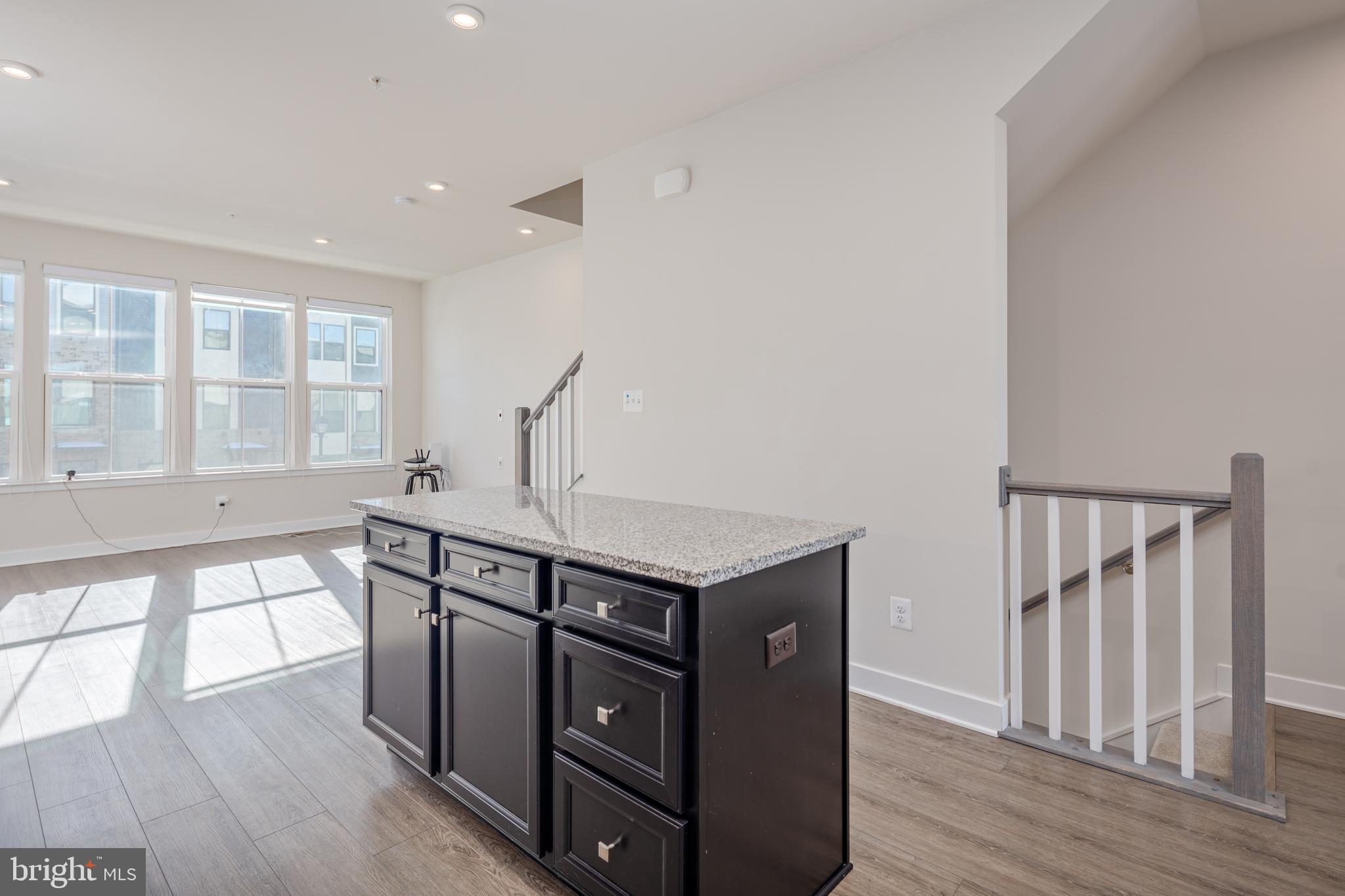 1920 Four Roses Street Baltimore, MD 21222 - Photo 8 of 37 a view of a kitchen with furniture and wooden floor