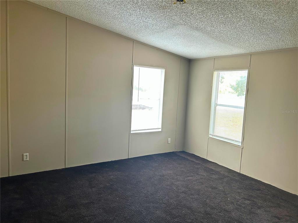 9867 Jerome Drive New Port Richey, FL 34654 - Photo 8 of 30 a view of an empty room with a window