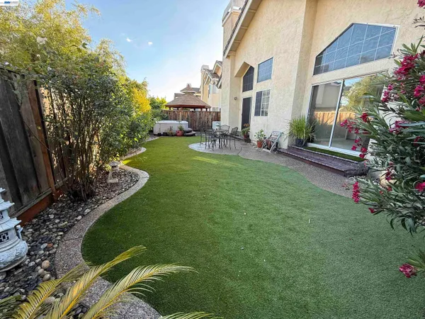 a patio with table and chairs