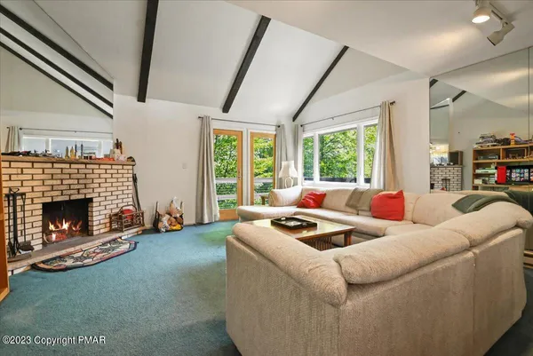 a bedroom with furniture and a window
