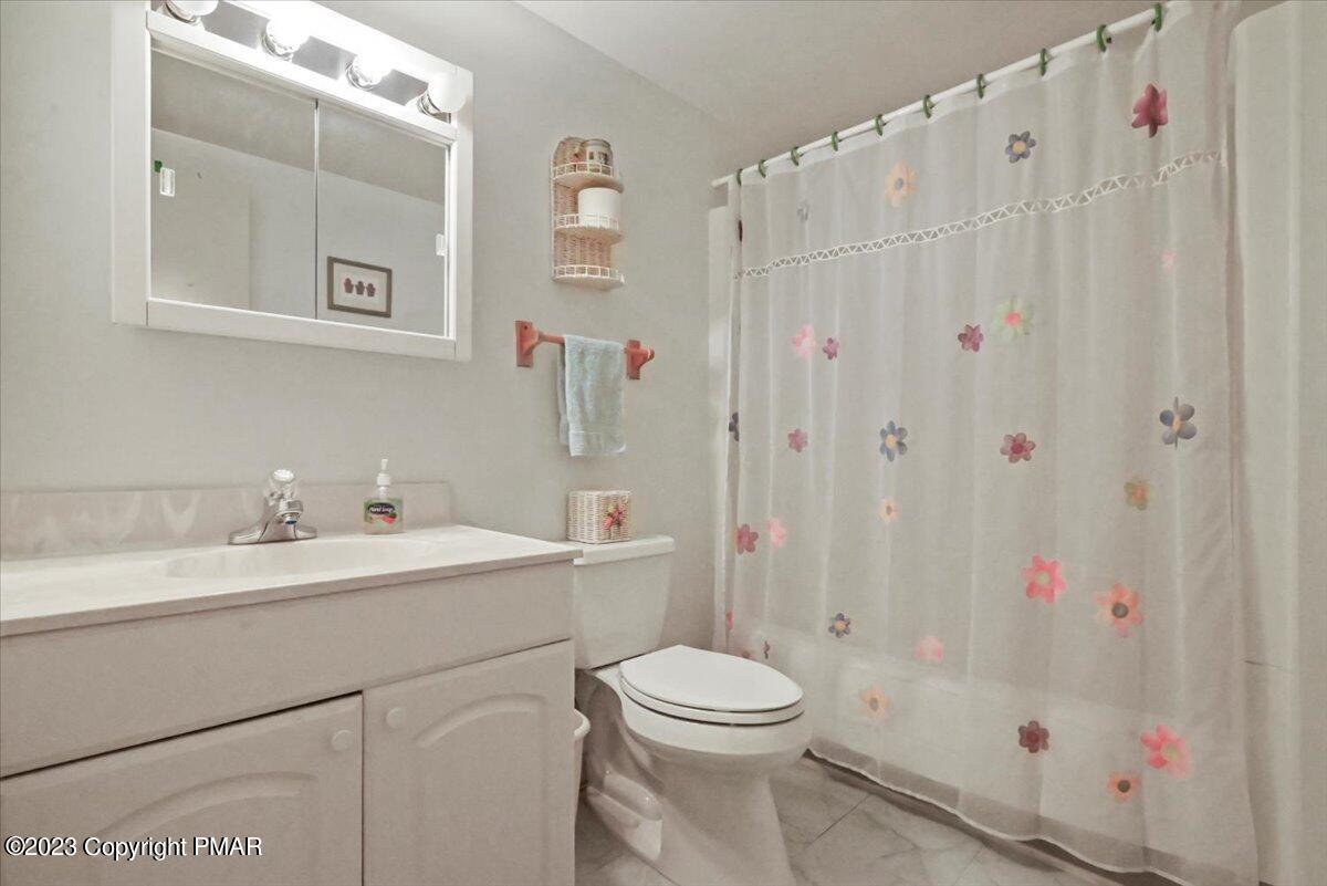 18 Middle Village Way Tannersville, PA 18372 - Photo 23 of 29 a bathroom with a sink a toilet and a shower