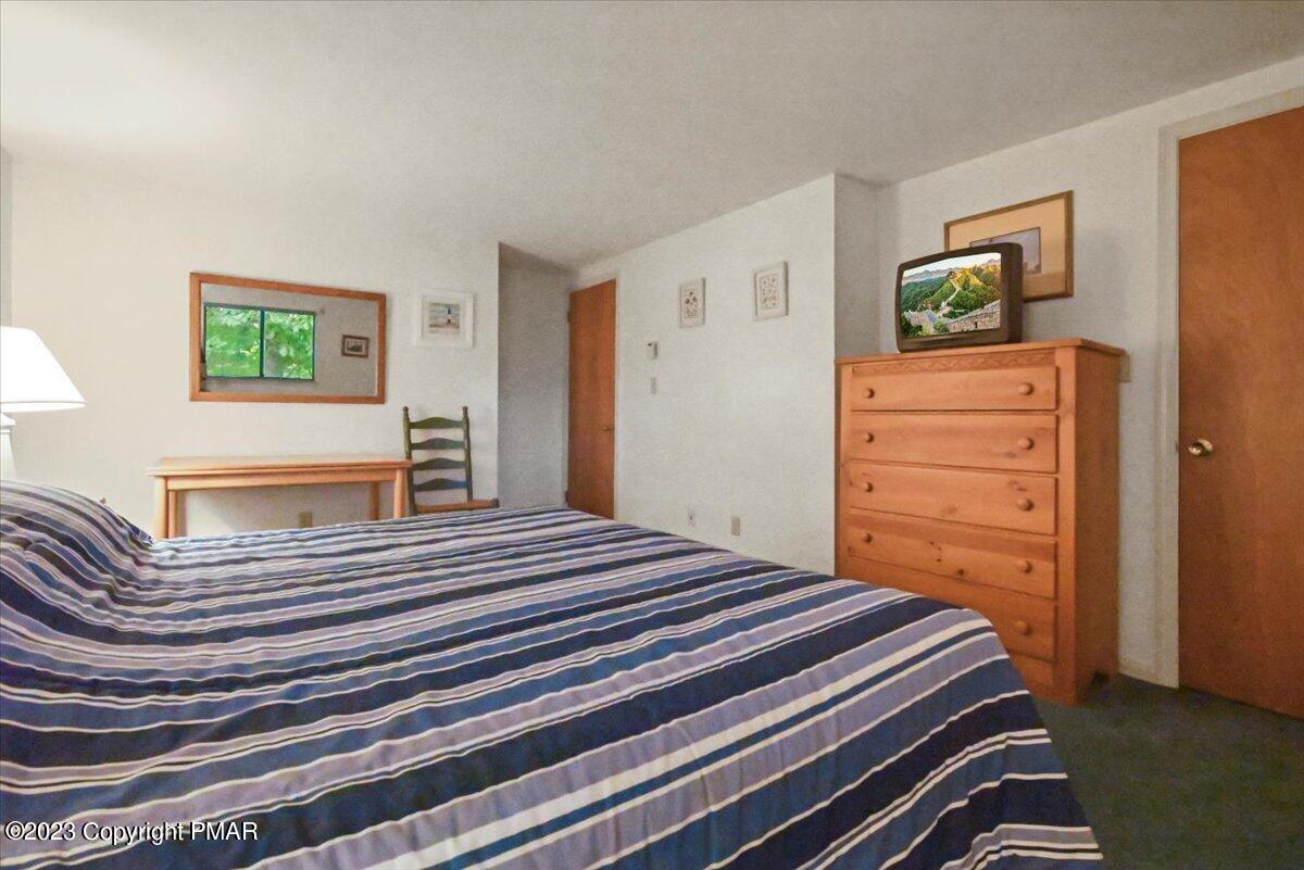 18 Middle Village Way Tannersville, PA 18372 - Photo 24 of 29 a bedroom with a bed and wooden floor