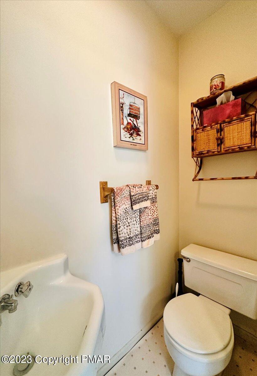 18 Middle Village Way Tannersville, PA 18372 - Photo 7 of 29 a white toilet sitting next to a bathroom sink