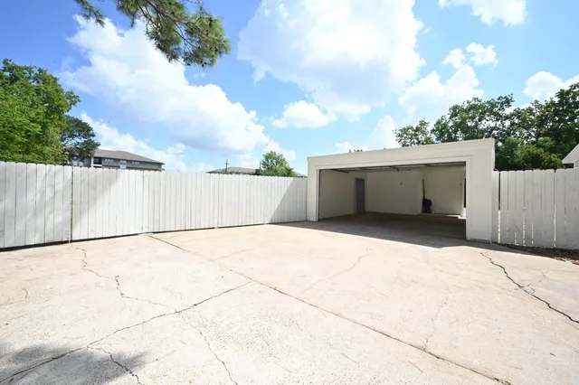 a view of backyard with potted plants