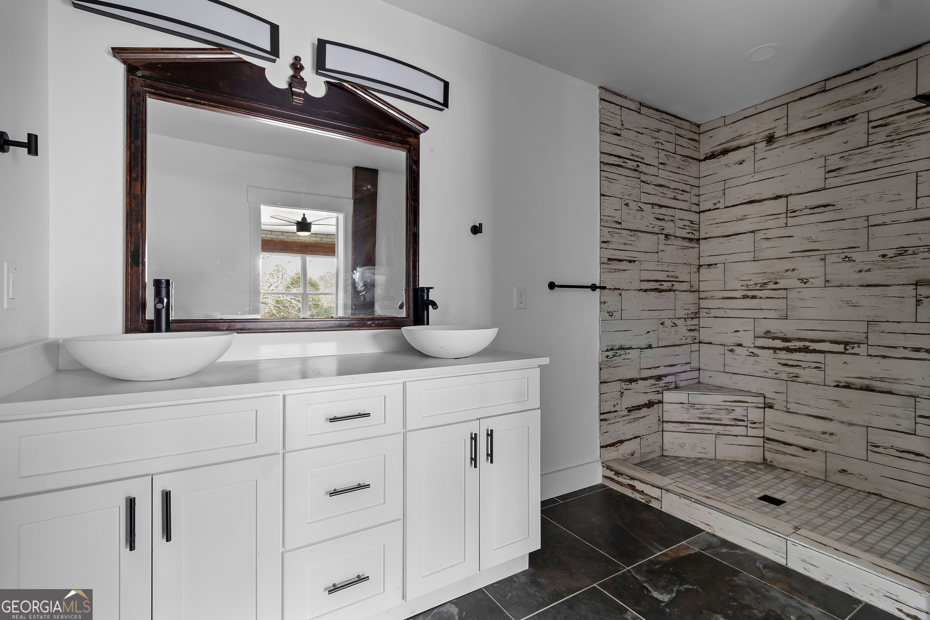 610 Madola Road, Unit 4 Epworth, GA 30541 - Photo 14 of 16 a bathroom with a granite countertop sink a toilet and a mirror