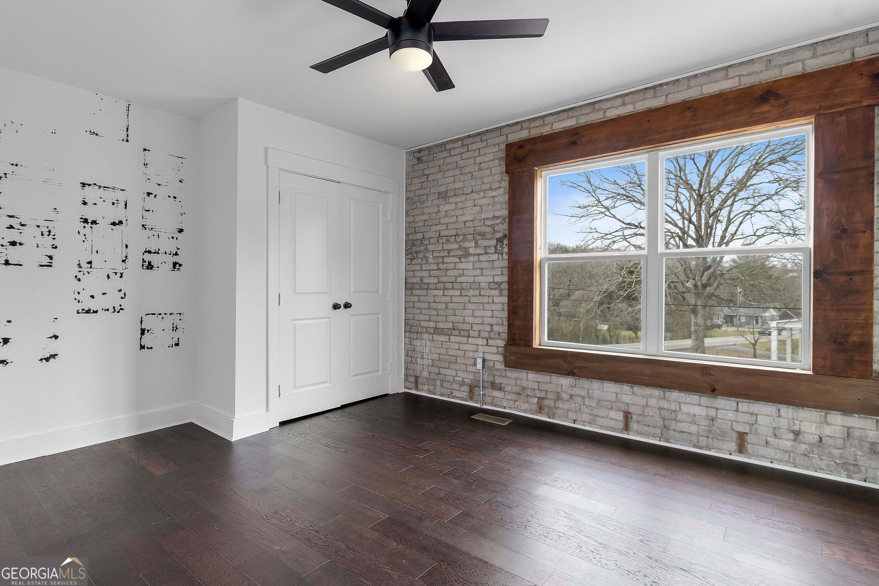 610 Madola Road, Unit 4 Epworth, GA 30541 - Photo 10 of 16 a view of a livingroom with wooden floor and a window