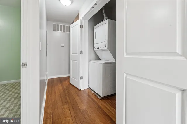 a view of hallway with wooden floor