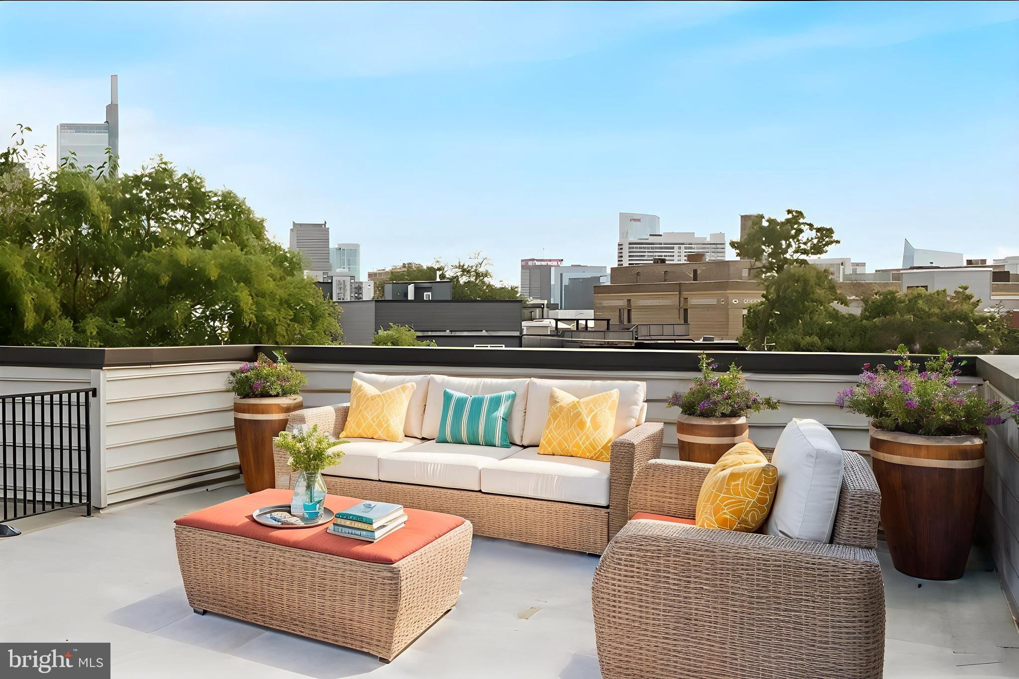 1608 Ridge Avenue, Unit 403 Philadelphia, PA 19130 - Photo 18 of 18 a view of a roof deck with couches and potted plants