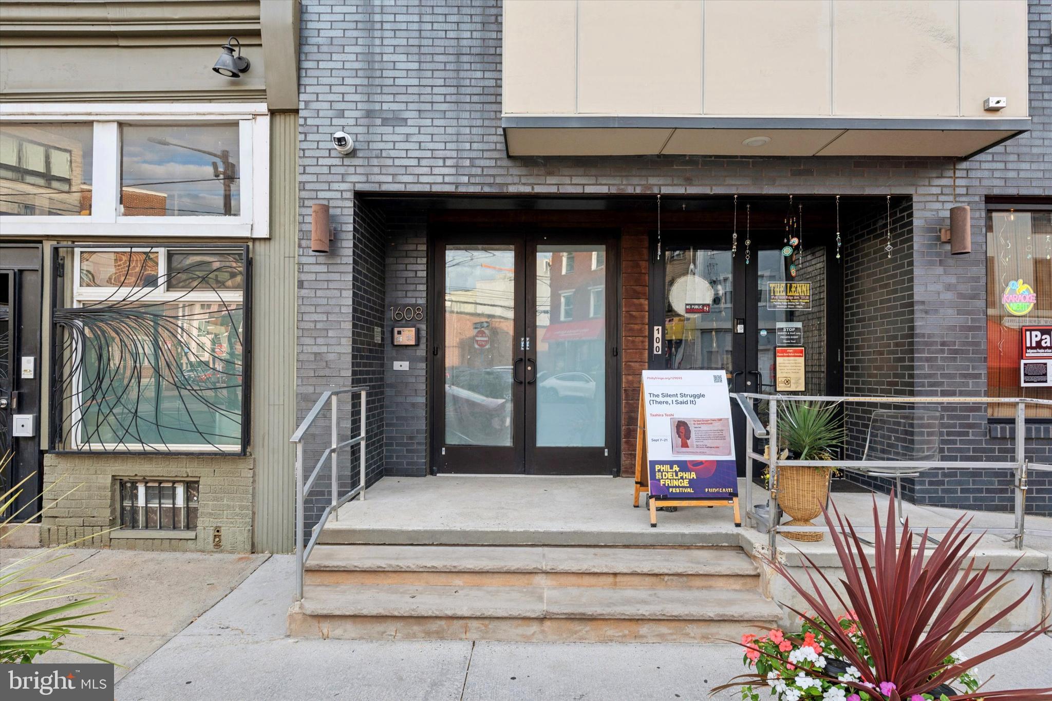 1608 Ridge Avenue, Unit 403 Philadelphia, PA 19130 - Photo 2 of 18 a front view of a building with glass windows and door