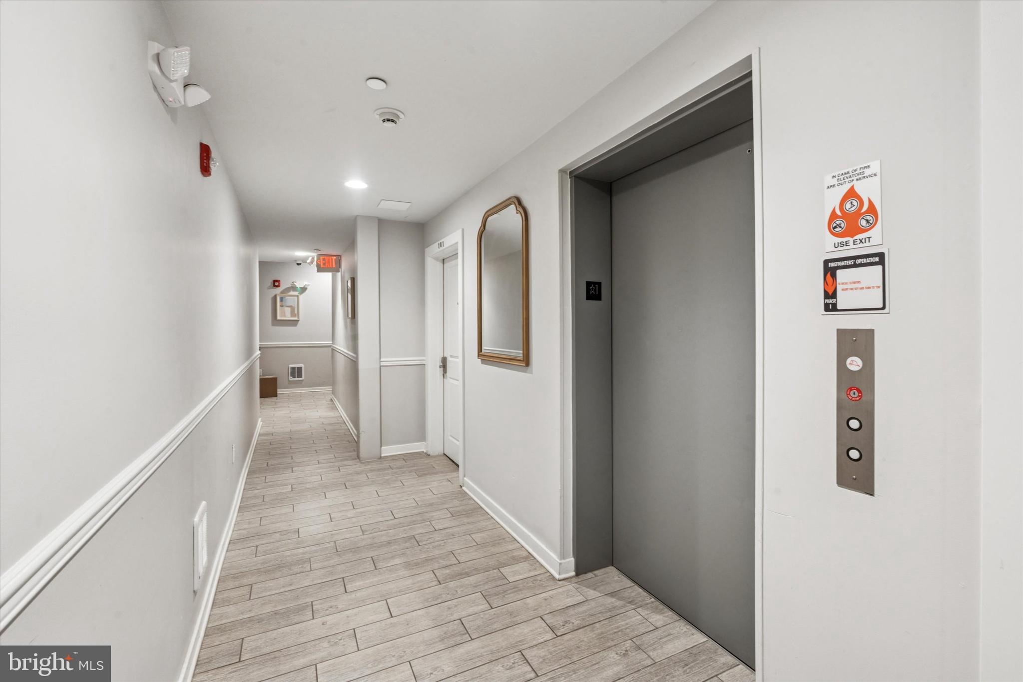 1608 Ridge Avenue, Unit 403 Philadelphia, PA 19130 - Photo 3 of 18 a view of a hallway with wooden floor and closet