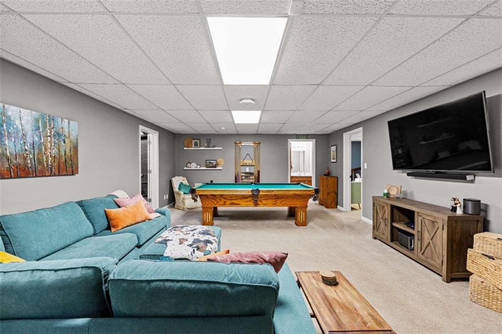 128 Byrom Road Senoia, GA 30276 - Photo 47 of 83 a living room with furniture and a flat screen tv