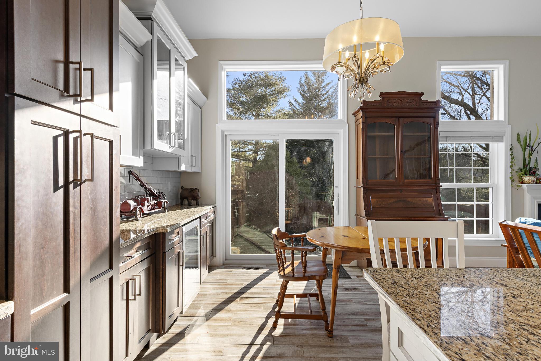 1 Hilltop Lane Medford, NJ 08055 - Photo 13 of 50 a kitchen with stainless steel appliances granite countertop a refrigerator a stove and a dining table with wooden floor