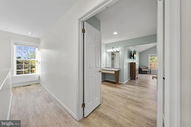 a view of a kitchen cabinets and wooden floor