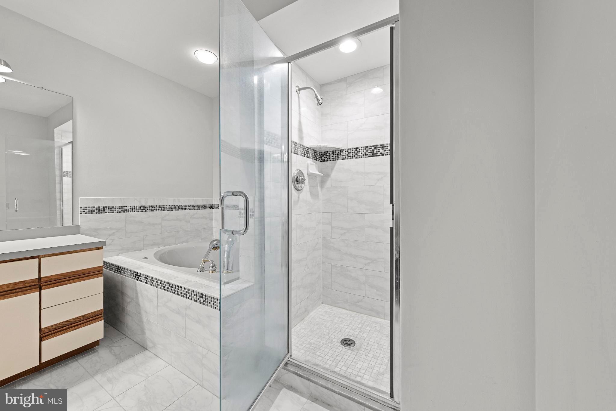 1 Hilltop Lane Medford, NJ 08055 - Photo 33 of 50 a bathroom with a tub shower sink and mirror