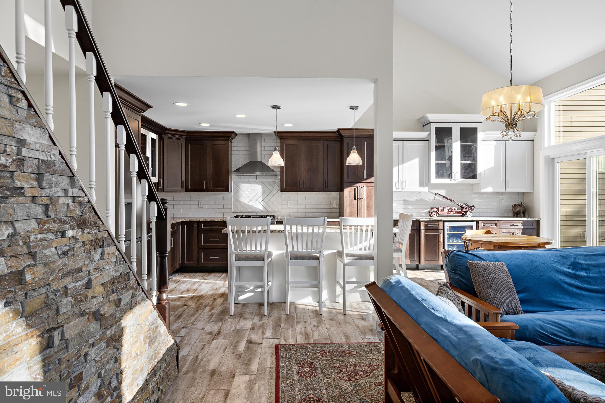1 Hilltop Lane Medford, NJ 08055 - Photo 4 of 50 a living room with furniture a fireplace and a chandelier