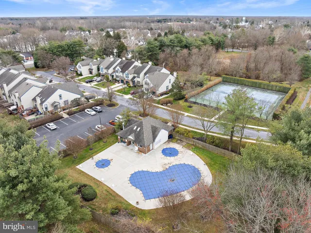 a view of a swimming pool with a yard