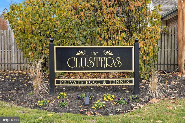 a sign broad in front of flowers