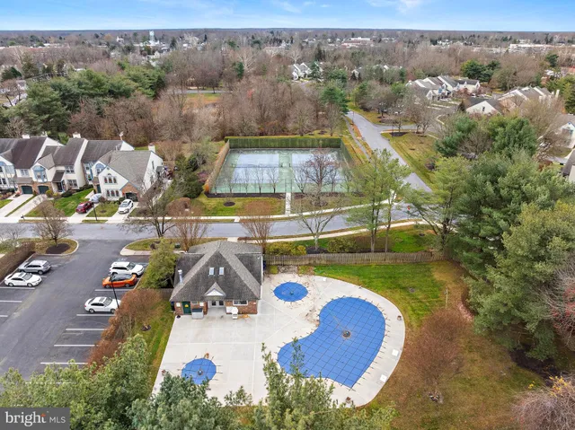 an aerial view of a house with a swimming pool